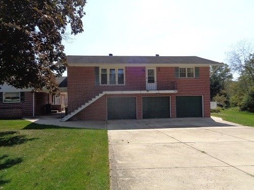 exterior space with a lawn and a garage