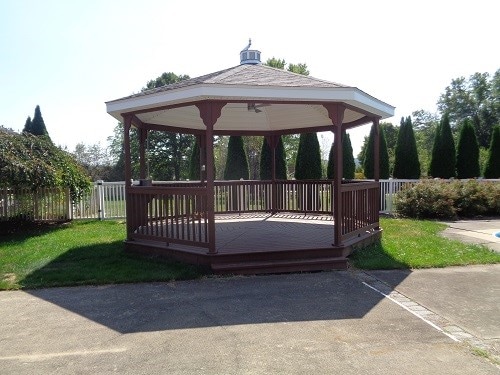 exterior space with a gazebo and a wooden deck