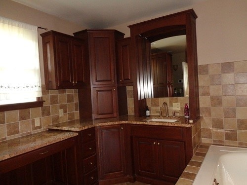 kitchen featuring light stone counters, sink, and a healthy amount of sunlight