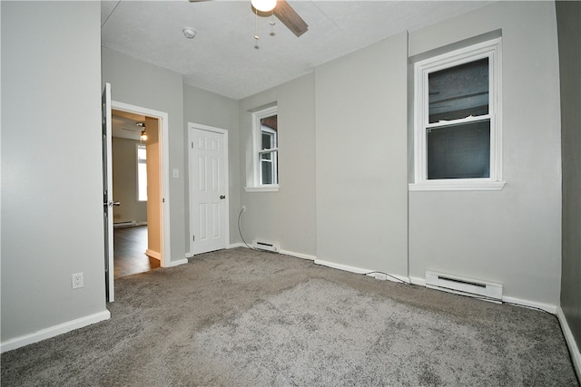 unfurnished bedroom featuring ceiling fan, baseboard heating, carpet, and a textured ceiling