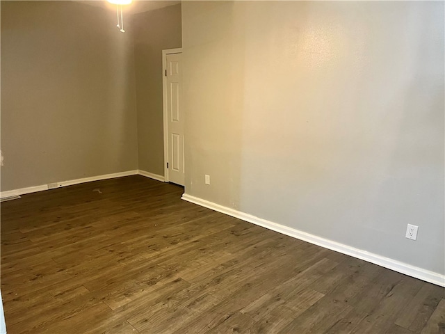 empty room featuring dark hardwood / wood-style flooring