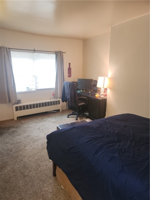 carpeted bedroom featuring radiator heating unit