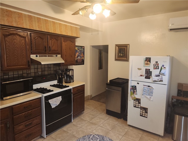 kitchen with light tile patterned flooring, white appliances, dark brown cabinetry, backsplash, and a wall mounted AC