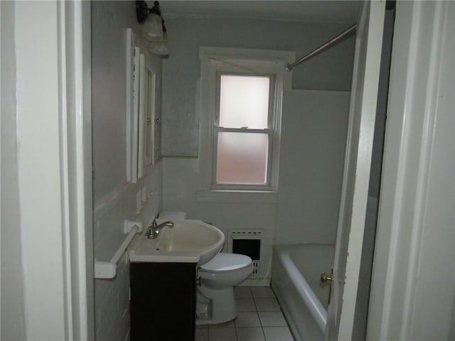 full bathroom featuring heating unit, tile patterned floors, shower / washtub combination, vanity, and toilet