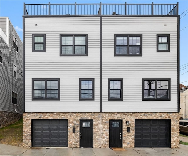 view of front of house with a balcony and a garage