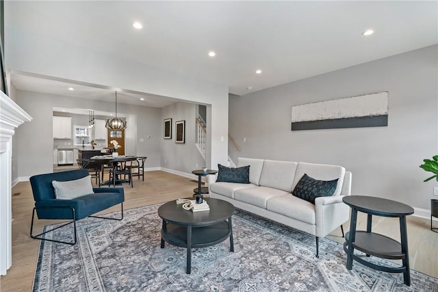 4602 Davison St, Lawrenceville, PA 15201 - living room with stairway, light wood-style floors, recessed lighting, and baseboards