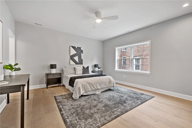 bedroom with light wood-type flooring and ceiling fan