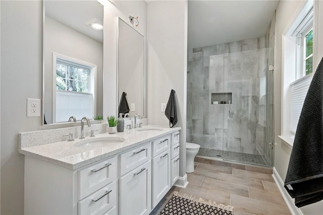 4602 Davison St, Lawrenceville, PA 15201 - full bath with a shower stall, toilet, and double vanity