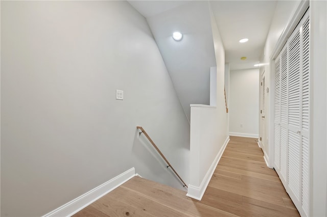 hallway with light hardwood / wood-style flooring