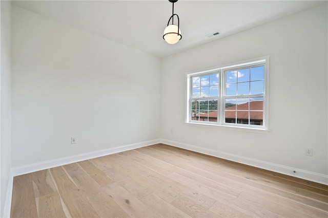 empty room featuring light hardwood / wood-style floors