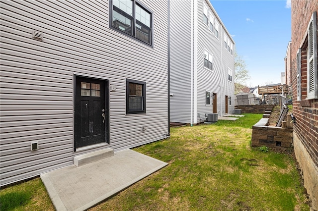 4602 Davison St, Lawrenceville, PA 15201 - back of house with a lawn, a patio area, and central AC unit