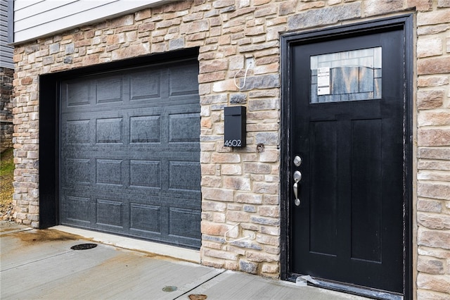 view of exterior entry featuring a garage