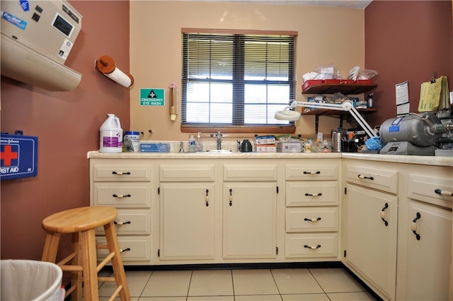 kitchen with light tile patterned flooring