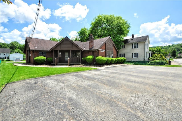 view of front of house with a garage and a front yard