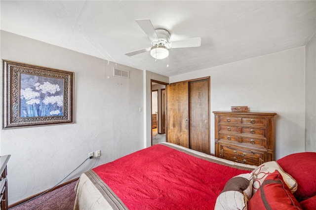 bedroom with ceiling fan and a closet