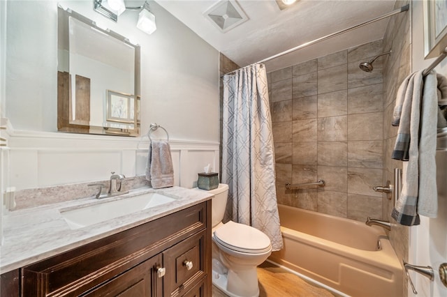 full bathroom featuring vanity, wood-type flooring, toilet, shower / bathtub combination with curtain, and lofted ceiling