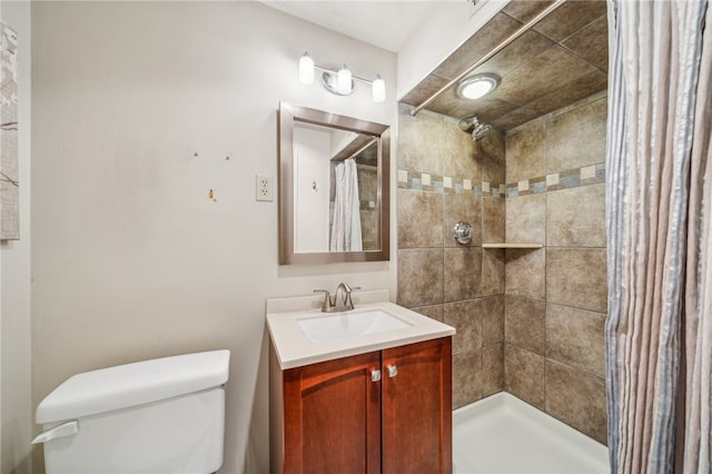 bathroom featuring vanity, toilet, and walk in shower