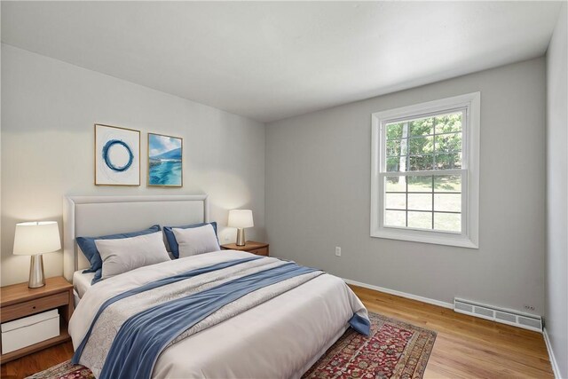 bedroom with light hardwood / wood-style floors