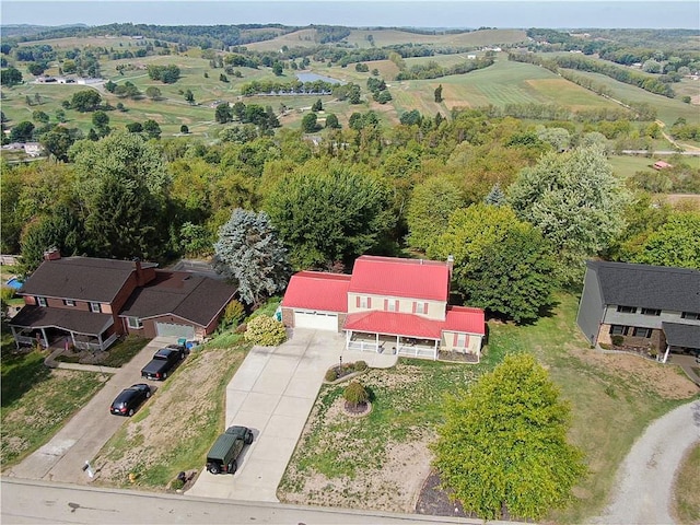 birds eye view of property with a rural view