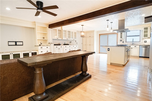 interior space featuring beamed ceiling, sink, light hardwood / wood-style floors, and ceiling fan