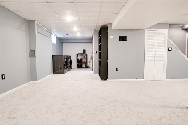 basement featuring carpet and washing machine and dryer