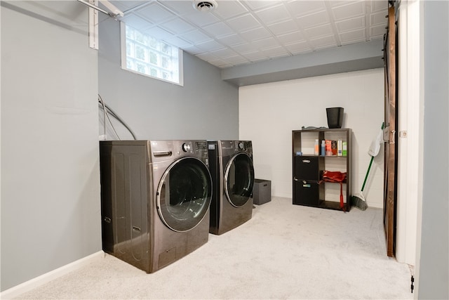 laundry area with light carpet and independent washer and dryer