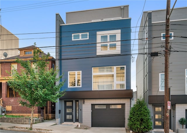 view of front of property with a garage