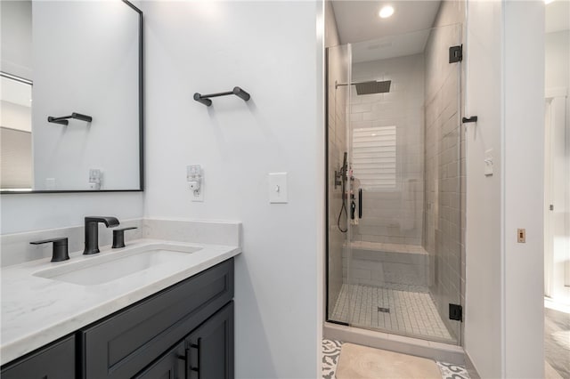 bathroom with vanity and an enclosed shower