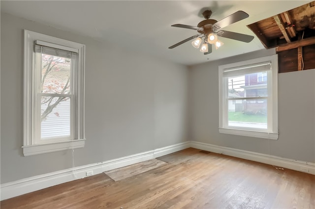 empty room featuring light wood-type flooring and ceiling fan