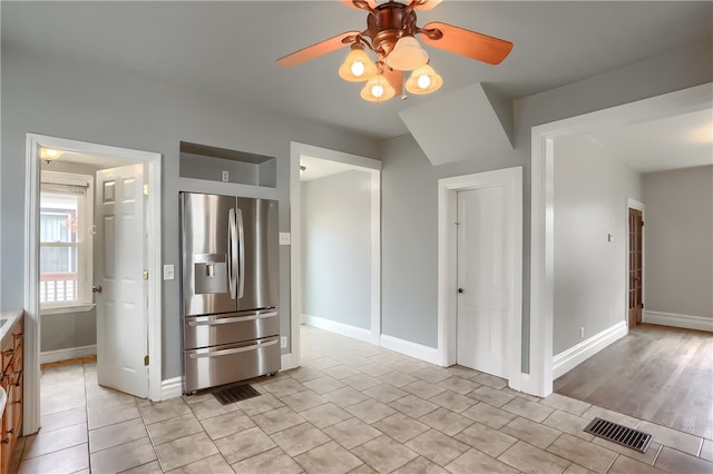 kitchen featuring ceiling fan, light hardwood / wood-style floors, and stainless steel refrigerator with ice dispenser