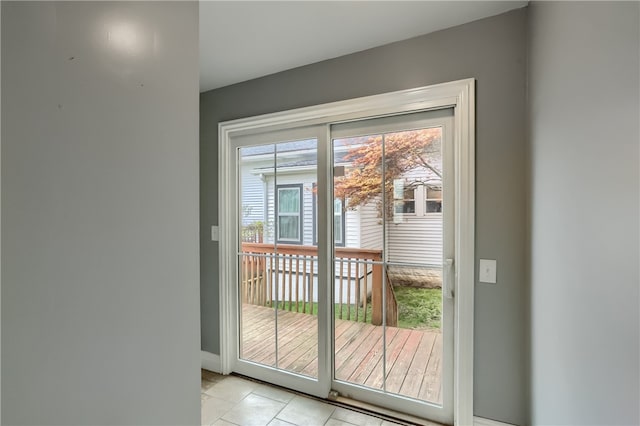 doorway to outside featuring light tile patterned floors