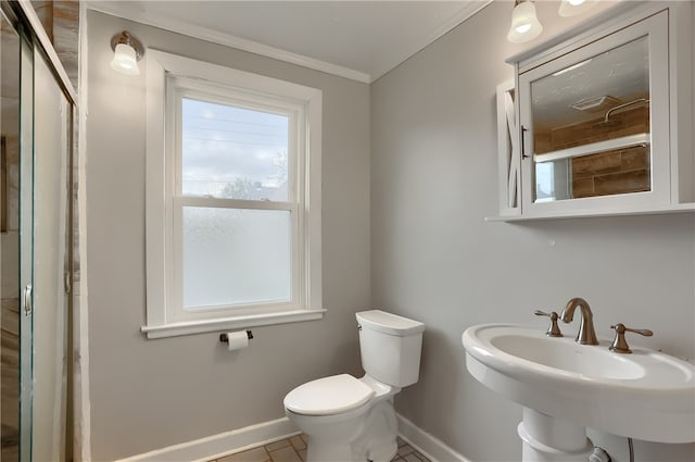 bathroom featuring tile patterned floors, crown molding, toilet, and sink