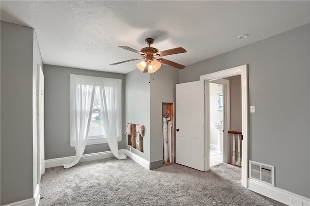 recreation room featuring light carpet and ceiling fan