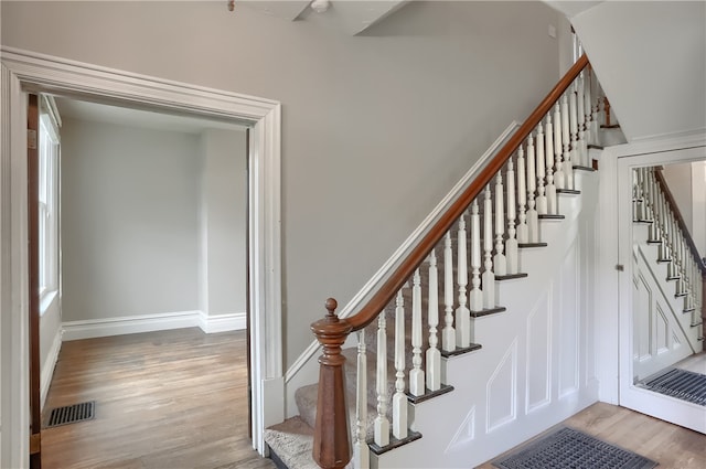 stairway with wood-type flooring