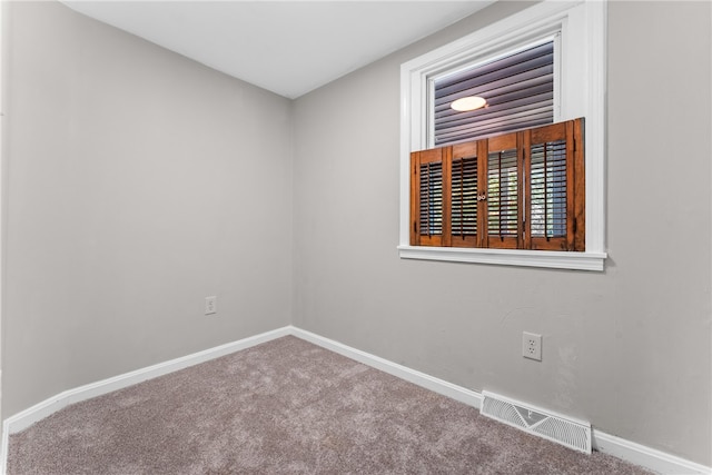 unfurnished room with carpet flooring