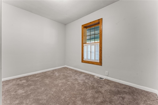 unfurnished room featuring carpet flooring