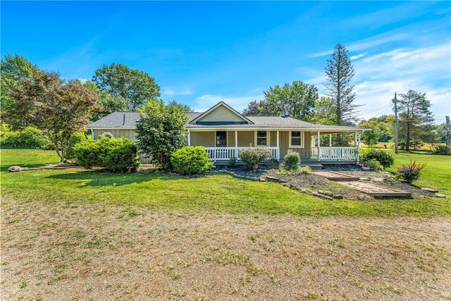 ranch-style home featuring a front yard and a porch