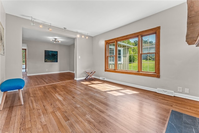 unfurnished room featuring hardwood / wood-style floors