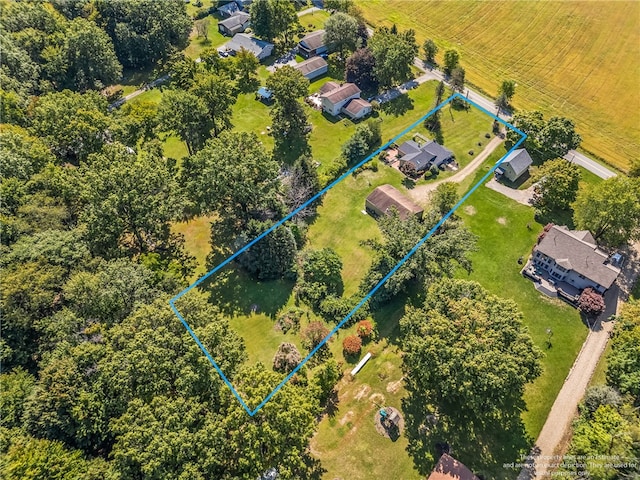 birds eye view of property with a rural view