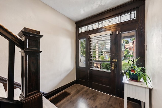 foyer featuring dark hardwood / wood-style floors