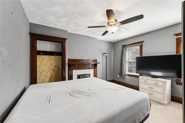 carpeted bedroom featuring ceiling fan