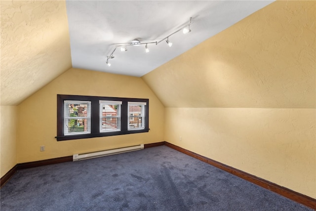 bonus room with lofted ceiling, a baseboard radiator, and carpet floors