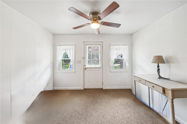 foyer with carpet flooring and ceiling fan