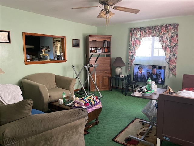 carpeted living room featuring ceiling fan