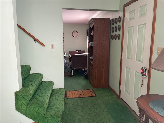 corridor with dark colored carpet