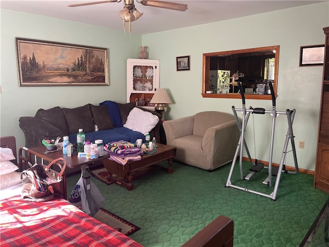 living room with ceiling fan and dark carpet