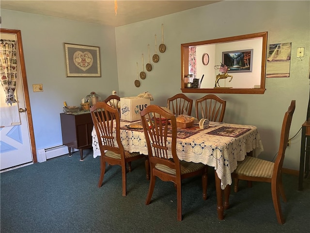 carpeted dining room with a baseboard heating unit