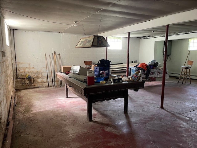 basement featuring a baseboard heating unit