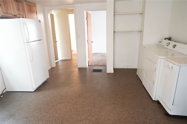 laundry room with washing machine and clothes dryer