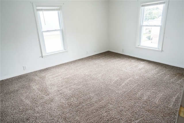 spare room featuring carpet flooring